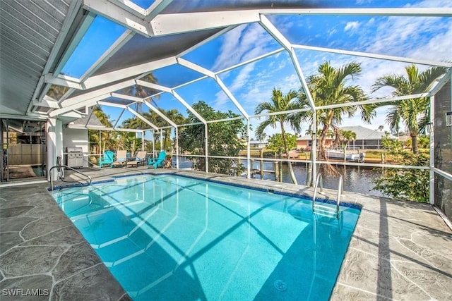 view of pool featuring a water view, a grill, a lanai, and a patio