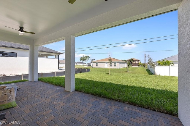 view of patio featuring ceiling fan