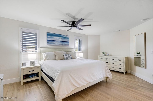 bedroom featuring light hardwood / wood-style floors and ceiling fan