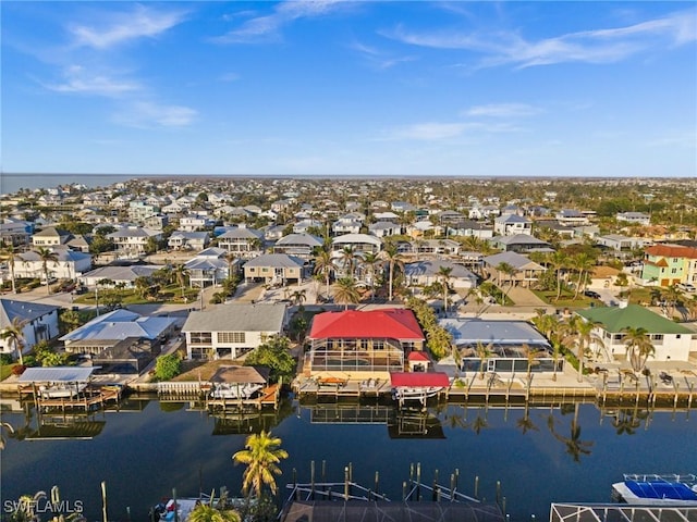 drone / aerial view with a water view