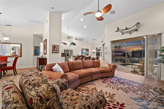 living room with light tile patterned floors, high vaulted ceiling, and ceiling fan