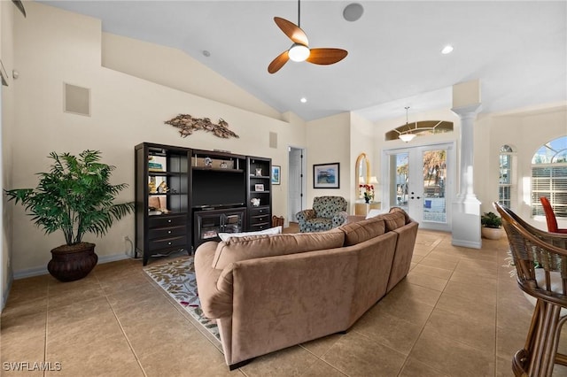 tiled living room featuring decorative columns, high vaulted ceiling, ceiling fan, and french doors