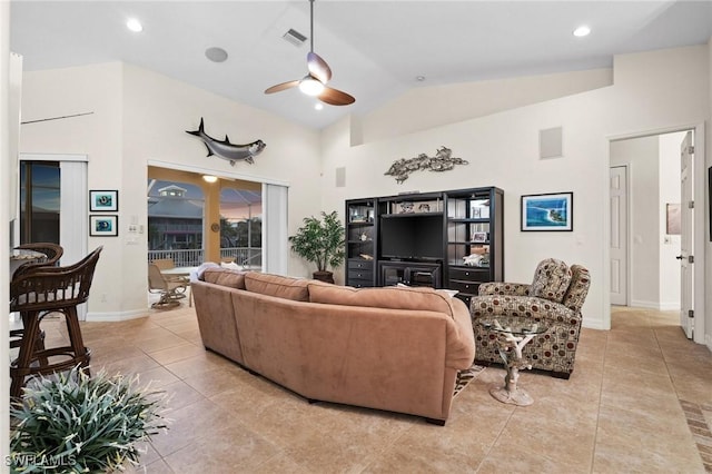 tiled living room featuring vaulted ceiling and ceiling fan