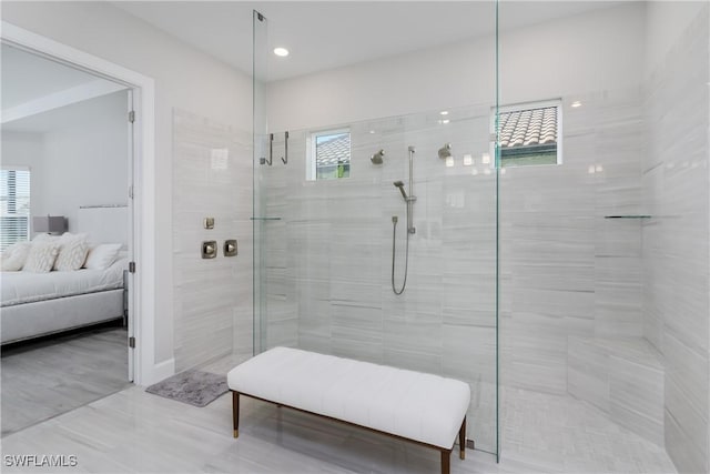 bathroom with a tile shower