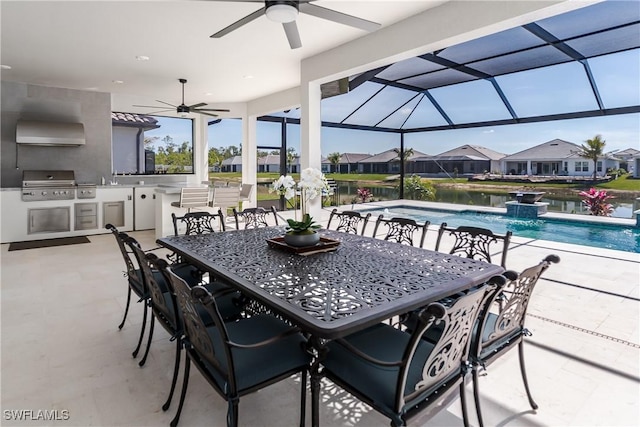 view of patio / terrace featuring an outdoor kitchen, area for grilling, a lanai, ceiling fan, and exterior bar