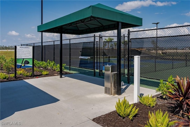 view of patio / terrace with tennis court