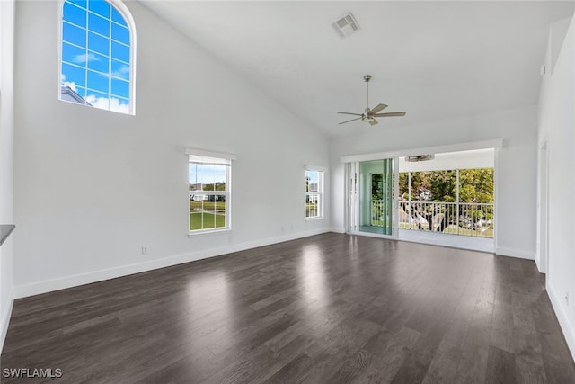 unfurnished living room with high vaulted ceiling, dark wood-type flooring, and ceiling fan