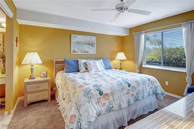 carpeted bedroom featuring ceiling fan