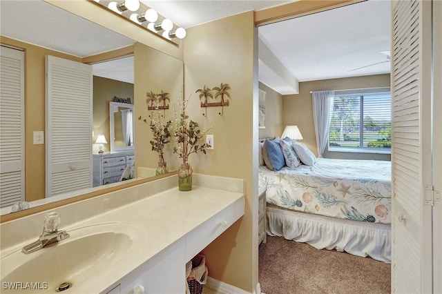 ensuite bathroom with vanity and ensuite bath