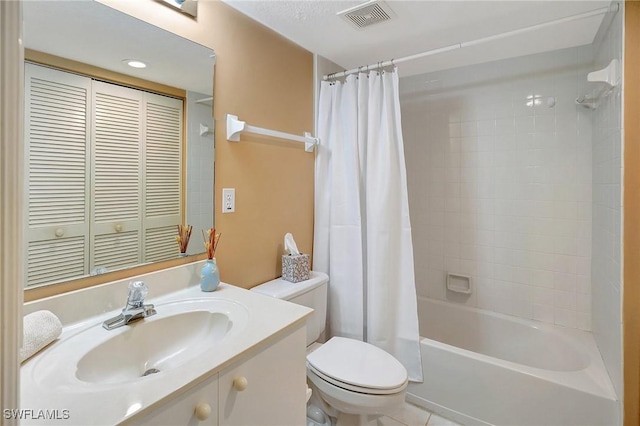 bathroom with toilet, shower / tub combo, vanity, visible vents, and a closet