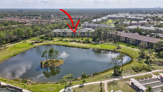 birds eye view of property with a water view