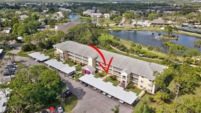 bird's eye view with a water view and a residential view