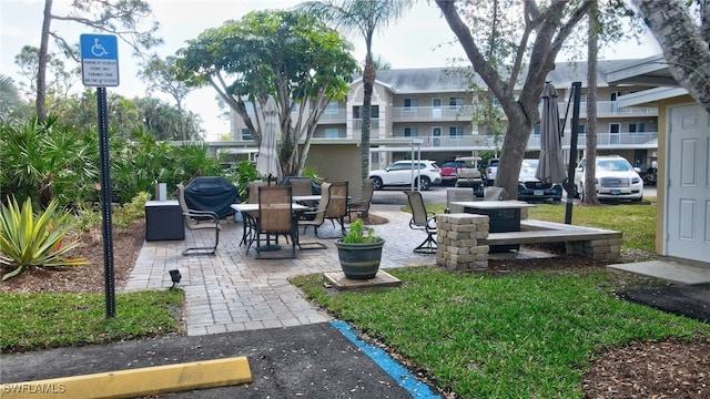 surrounding community featuring a patio area