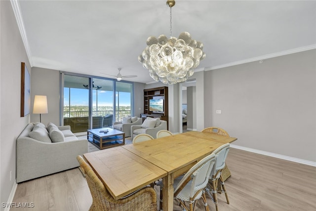 dining room with baseboards, ornamental molding, light wood finished floors, and floor to ceiling windows