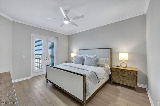 bedroom featuring ornamental molding, access to outside, light wood-style flooring, and baseboards