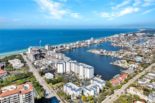 birds eye view of property with a water view and a city view