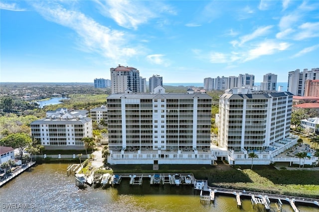 drone / aerial view featuring a water view and a city view