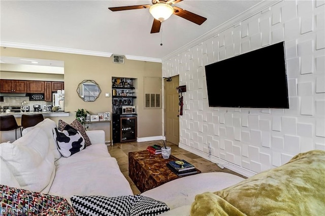 living room with ornamental molding, beverage cooler, and ceiling fan