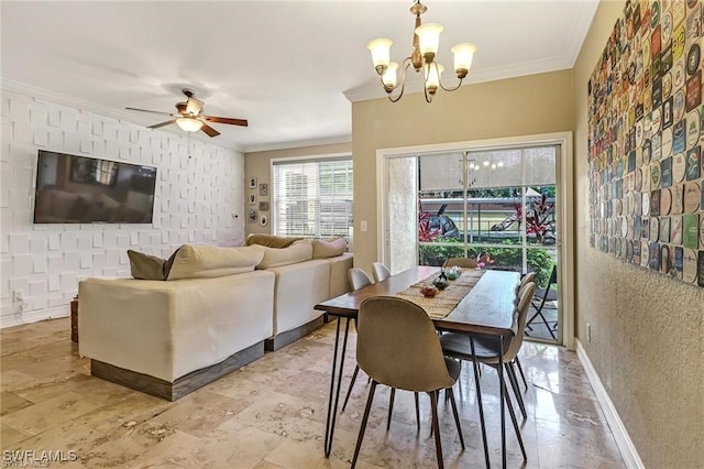 dining area featuring crown molding and ceiling fan with notable chandelier