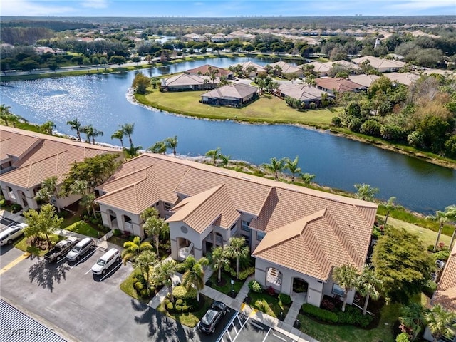 aerial view with a water view and a residential view