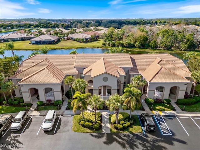 birds eye view of property with a water view