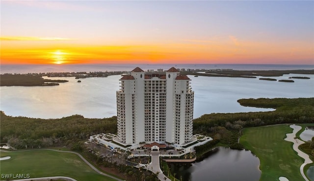 aerial view at dusk with a water view