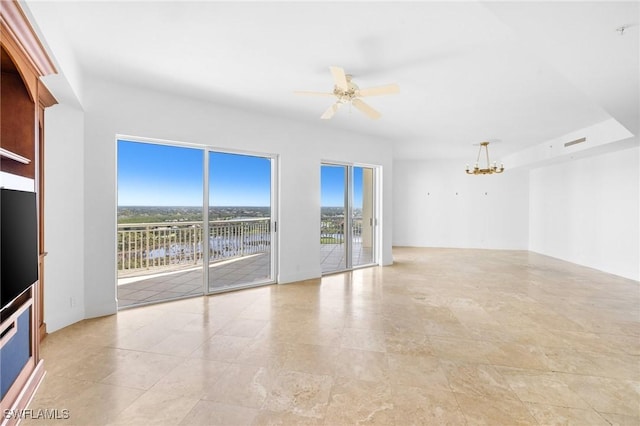 unfurnished room with ceiling fan with notable chandelier