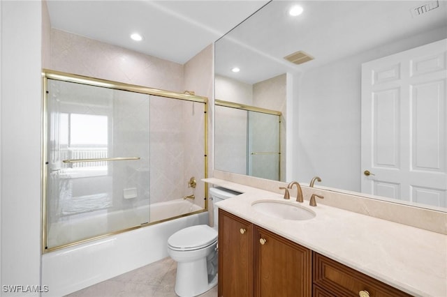 full bathroom with enclosed tub / shower combo, vanity, toilet, and tile patterned flooring