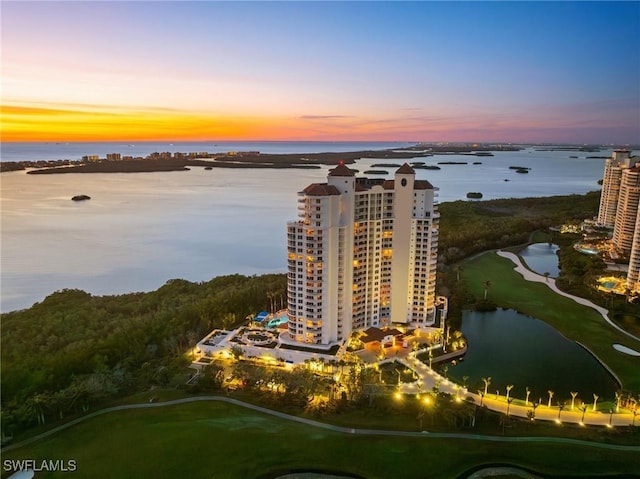 aerial view at dusk with a water view