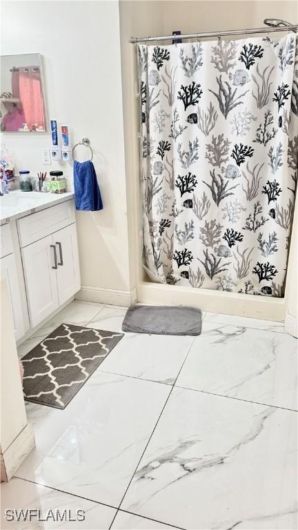 bathroom with vanity and walk in shower