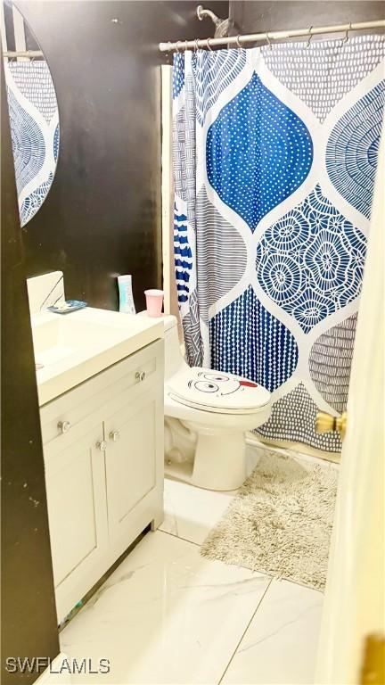 bathroom featuring vanity and toilet