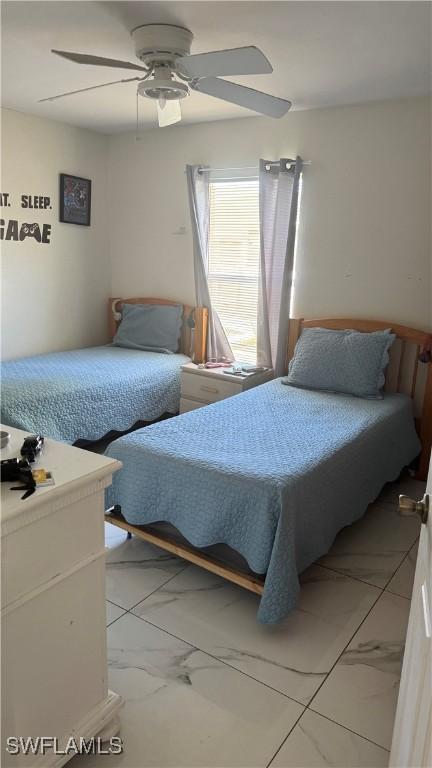 bedroom featuring ceiling fan