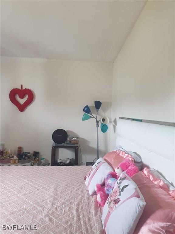 bedroom featuring lofted ceiling