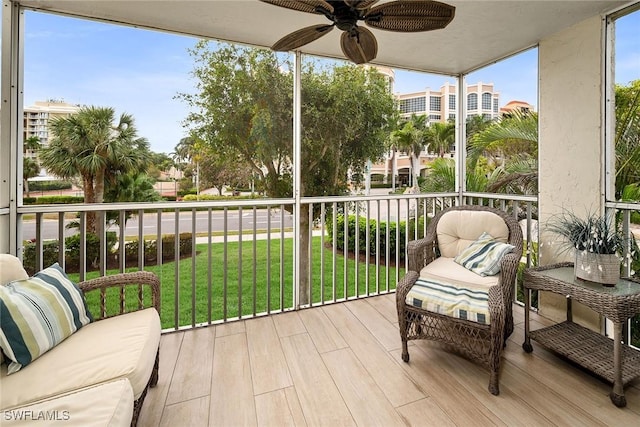 sunroom with ceiling fan