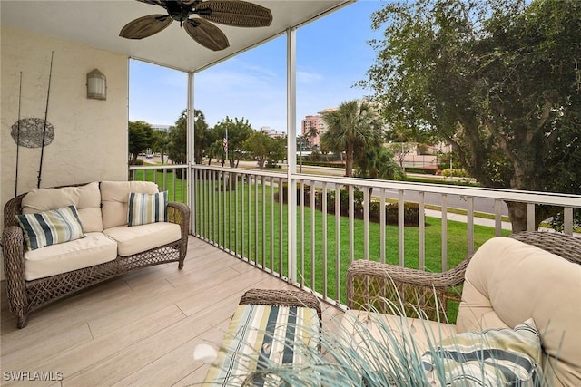 balcony with an outdoor hangout area and ceiling fan