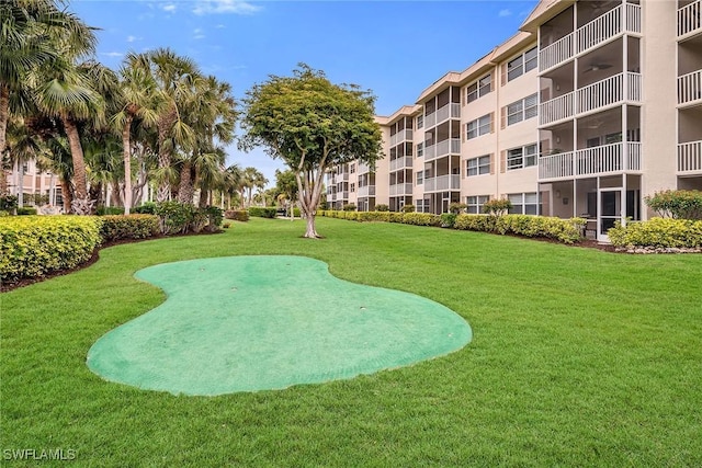 view of community featuring a yard