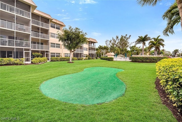 view of home's community featuring a lawn