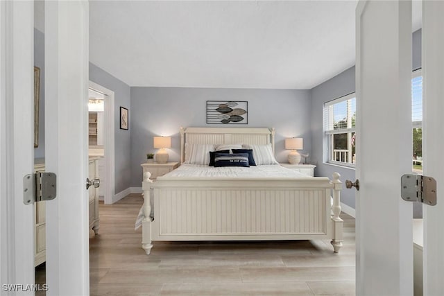 bedroom with light hardwood / wood-style flooring