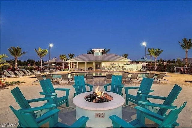 view of patio / terrace featuring a fire pit and a gazebo