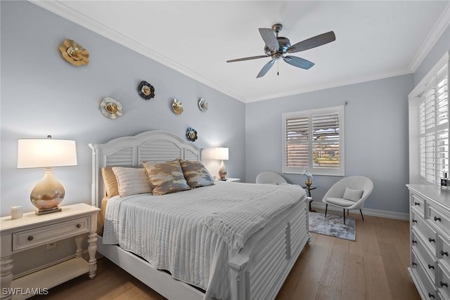 bedroom with crown molding, dark hardwood / wood-style floors, and ceiling fan