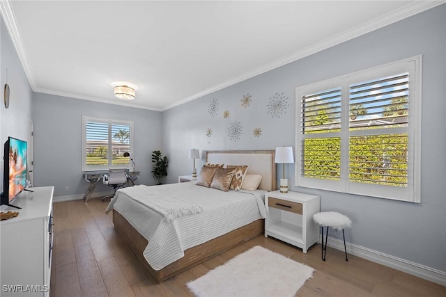 bedroom with crown molding and wood-type flooring