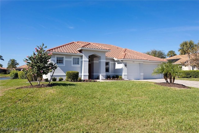 mediterranean / spanish-style home featuring a garage and a front lawn