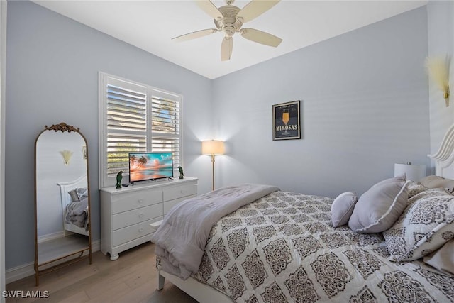 bedroom featuring ceiling fan and light hardwood / wood-style flooring