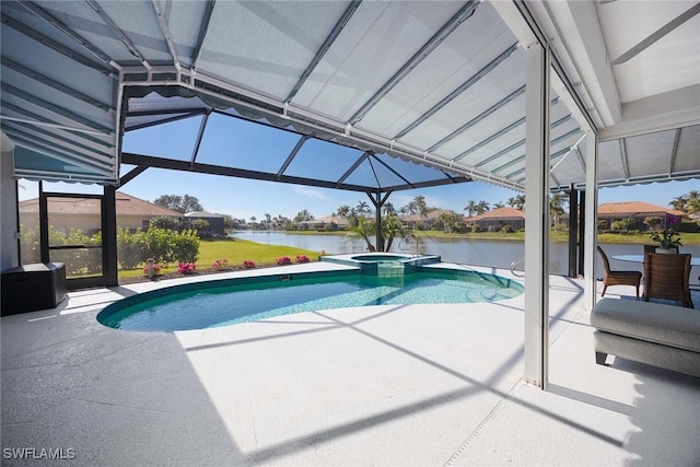 view of pool with an in ground hot tub, a water view, a lanai, and a patio area