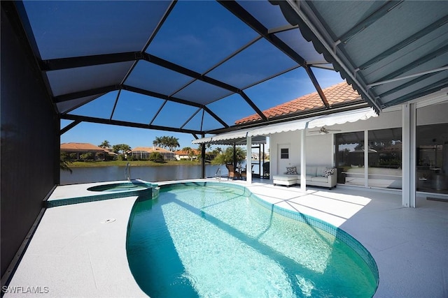 view of swimming pool with an in ground hot tub, a water view, a patio area, and glass enclosure