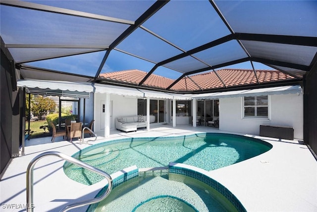 view of swimming pool featuring a lanai, a patio area, outdoor lounge area, and an in ground hot tub