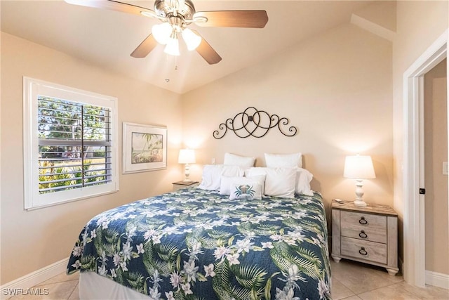 bedroom featuring light tile patterned floors and ceiling fan