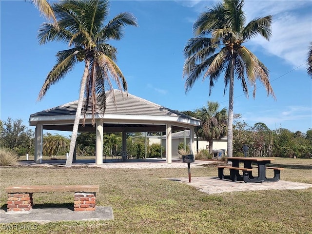 surrounding community featuring a gazebo and a lawn