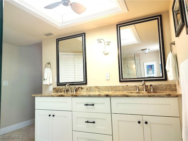 bathroom with ceiling fan, tile patterned floors, vanity, and ornamental molding