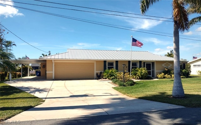 view of front of house with a garage, a front yard, and a carport